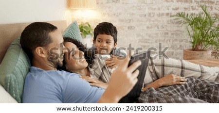 Family, bed and watching on tablet with a smile and cartoon with mom, dad and kid together. Bedroom, tech and education children program with mother, father and young boy with a youth movie at home
