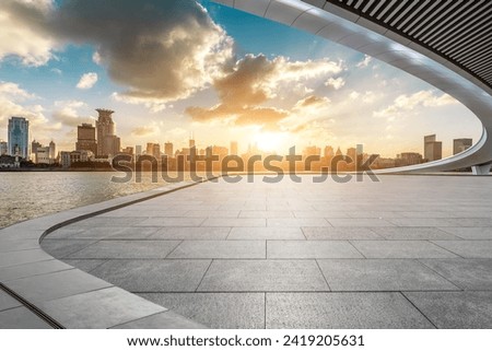 Empty square floor and bridge with city skyline at sunset in Shanghai Royalty-Free Stock Photo #2419205631