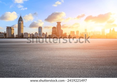 Asphalt road square and modern city buildings at sunset in Shanghai Royalty-Free Stock Photo #2419221497