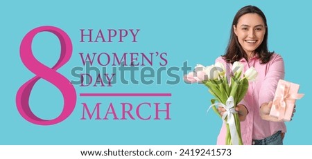 Beautiful young woman with gift and bouquet of tulips on light blue background. Banner for International Women's Day