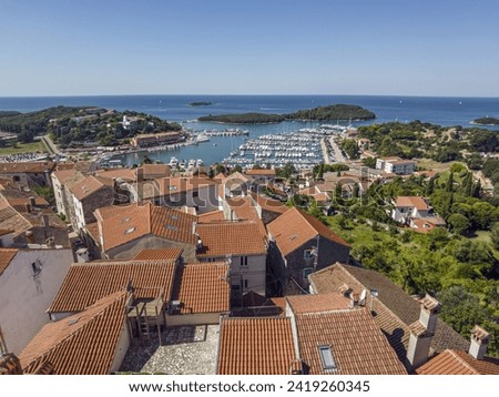 Panoramic picture of the Croatian harbor town of Vrsar on the Limski Fjord from the church bell tower during daytime