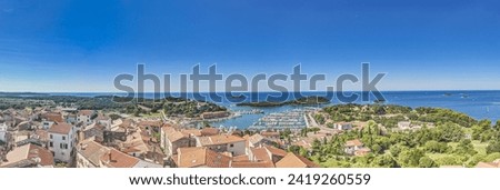 Panoramic picture of the Croatian harbor town of Vrsar on the Limski Fjord from the church bell tower during daytime
