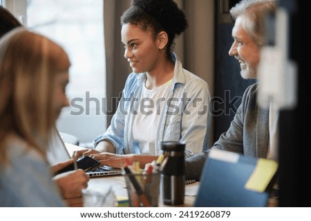 Businessteam working together on project Royalty-Free Stock Photo #2419260879