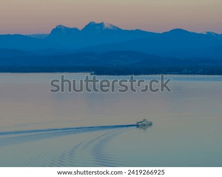 Small island from above at sunset winter, aerial view at Chiemsee lake