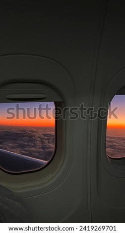 It is a sunset from a flying airplane. It's a picture of the sky as if it's on fire. I want to name the title of this picture Fire Watch.