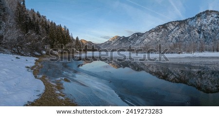 Mittersee at sunset winter in Bavarian Alps, aerial view