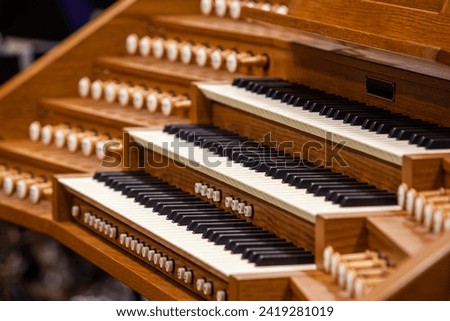 Close-up fragment of a church organ Royalty-Free Stock Photo #2419281019