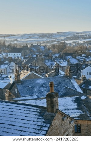 Rooftop view of Settle North Yorkshire in winter snow Royalty-Free Stock Photo #2419283265