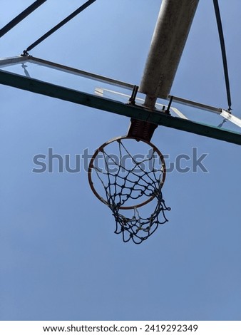 ring attached to the basketball backboard and the background behind it is the open blue sky making this picture awesome