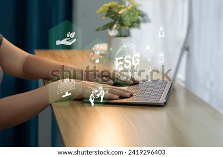 Investment business ideas on environmental governance, ESG, social business strategy, environment, sustainability risks Businessman uses computer to analyze ESG business investment strategy
