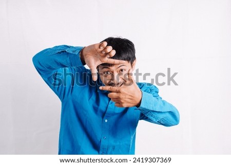 Young man taking picture pose on white background