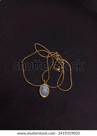 Aquamarine pendant gold necklace march birthstone jewellery Royalty-Free Stock Photo #2419319033