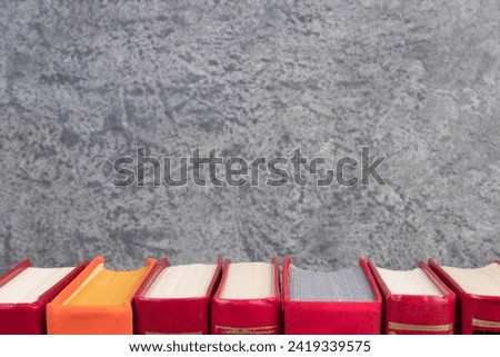 open book, books on the gray concrete background. Back to school. Education. Copy space for text