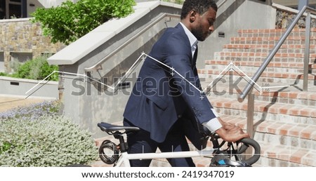 Image of financial data processing over african american businessman with bike. Global networks, business, finances, computing and data processing concept digitally generated image.