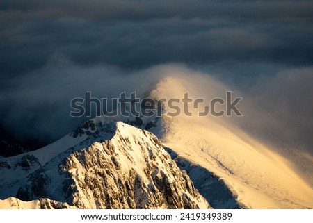 High mountains covered in clouds
