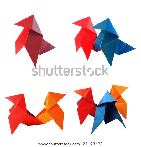 Paper cockerels isolated on a white background.
