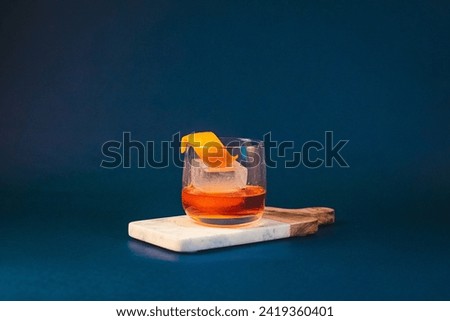Landscape Old fashioned Whiskey Cocktail in Blue Studio lighting