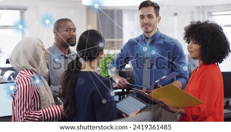 Image of connections and data processing over diverse business people in office. Global networks, business, finances, computing and data processing concept digitally generated image.