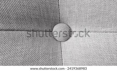 Elegance Embodied: A Beige Fabric Button Adorning Furniture, a Subtle Harmony of Aesthetics and Functionality Royalty-Free Stock Photo #2419368983