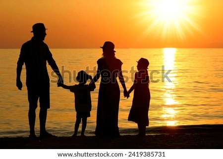 happy family by the sea in nature silhouette weekend travel