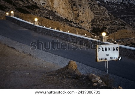 photograph of a roadside exit of a dirt car park, Greece, Karpathos