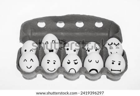 Easter fun. Easter concept. Faces drawn on easter eggs with copy space.