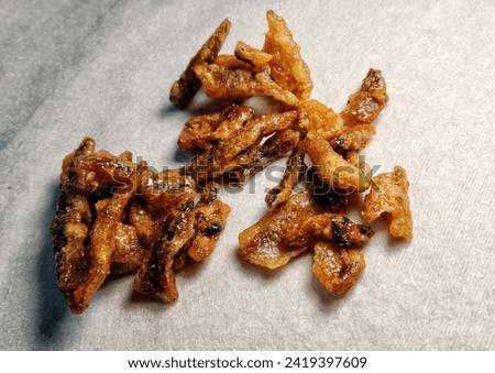 Picture of crispy fish, a local snack in Thailand made from small fish that are fried and then coated with sugar.