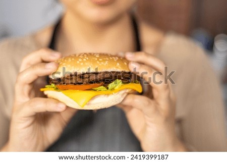 details of the texture of an exquisite hamburger with cheese, meat and vegetables, unhealthy food, studio photo for menu, fast food restaurant, background