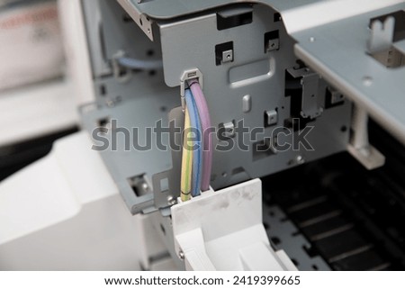 Wires, parts and mechanisms of an ink tube of an inkjet printer.