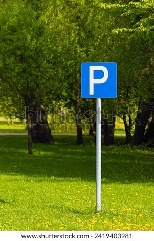 parking sign on the lawn in the park. parking space in the park