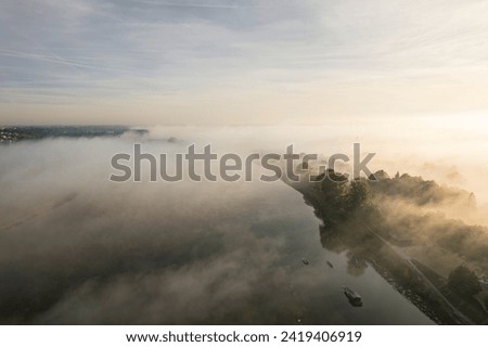 Enigmatic Mist Dances Above the Serpentine River Flowing Through Urban Blois, France