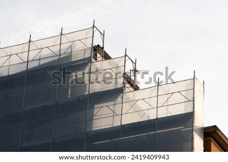 Scaffolding installed on a facade of a building in renovation