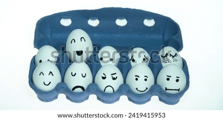 Easter fun. Easter concept. Faces drawn on easter eggs with copy space.