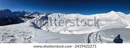 Ski tour to the Fanenstock and Farispitz above Elm. Large mountain panorama and beautiful winter landscape.