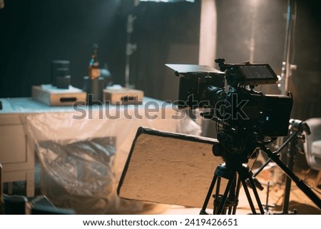 Professional cinema and video camera on the set. Shooting shift, lighting fixtures, shooting equipment and the team. Technique of modern filming and advertising.