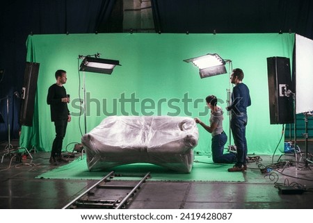 Film set, monitors and modern shooting equipment. Film crew, lighting devices, monitors, playbacks - filming equipment and a team of specialists in filming movies, advertising and TV series Royalty-Free Stock Photo #2419428087