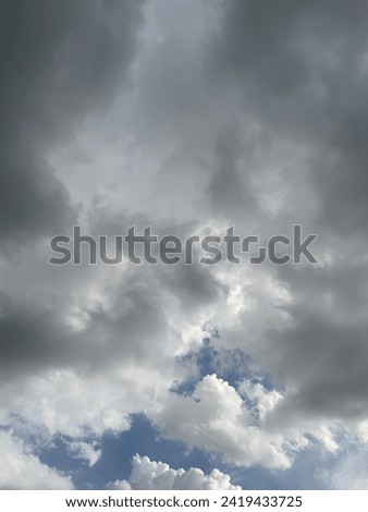 When the air rises gray stratocumulus clouds Slowly moving up and down in the beautiful sky at Bangkok,Thailand.no focus