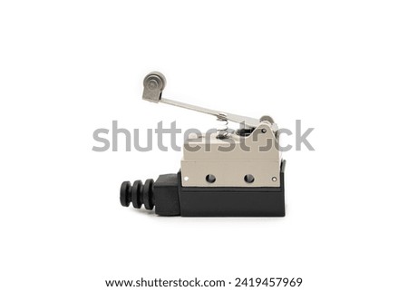Limit switch sensor of the machine. Tiny limit switch for mechanical movement and actuators limits. isolated, white background of limit switch, control device, electrical equipment in control system. Royalty-Free Stock Photo #2419457969