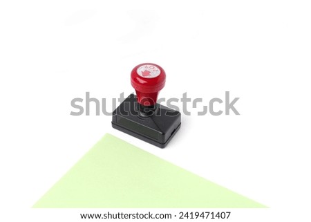 Stamp, modern rubber stamp product for paper stamps, red,on white and green background Royalty-Free Stock Photo #2419471407