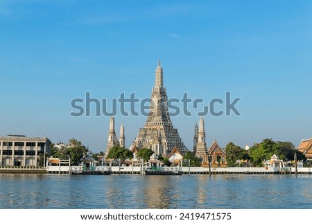 Wat Arun Ratchawararam is a Buddhist temple in Bangkok Yai district of Bangkok, Thailand. Royalty-Free Stock Photo #2419471575