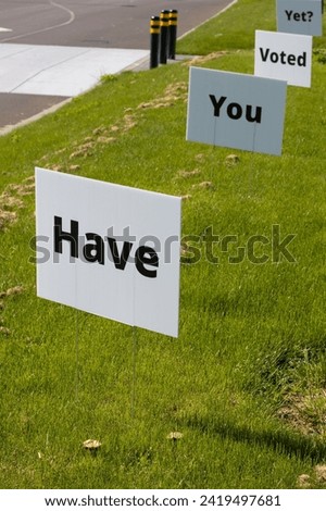 "Have You Voted Yet" lawn signs by the roadside. Election Day concept.