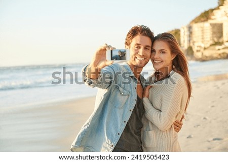 Couple, selfie and happy for hug by ocean for memory on vacation with care, love and bonding in summer. Man, woman and nature for holiday with photography, profile picture and beach on social network