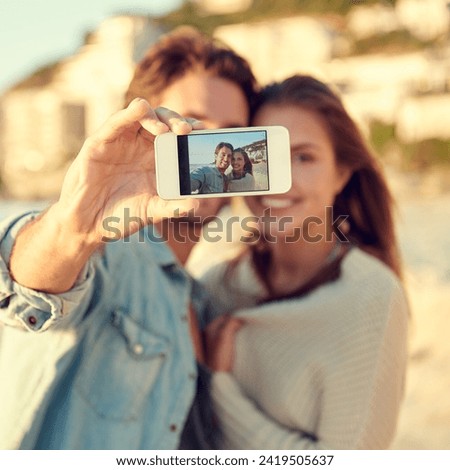 Couple, selfie and smile for hug by ocean for memory on vacation with care, love and tropical beach. Man, woman and smartphone screen for photography, profile picture and app by sea on social media