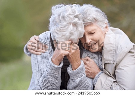 Senior woman, empathy and crying in nature, depression and grief in outdoor environment. Elderly people, garden and comforting or consoling in park, sadness and friend hugging for care in retirement Royalty-Free Stock Photo #2419505669