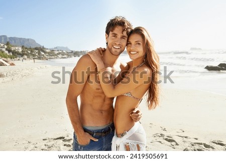 Beach, love and portrait of couple hug with care, support or and bonding in nature together. Ocean, face and happy people embrace at sea for travel, adventure and summer, vacation or weekend holiday Royalty-Free Stock Photo #2419505691