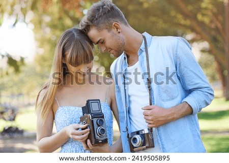 Retro camera, nature or couple check results of vintage photography, photo memory or creative photoshoot. Antique equipment, tourist or nature photographer looking at garden picture for media project