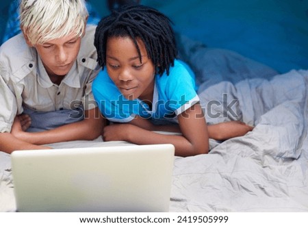 Children, relax and watch laptop on bed together with cartoon, movie or online games on holiday or vacation. Kids, smile and playing with computer on website, streaming or search on internet