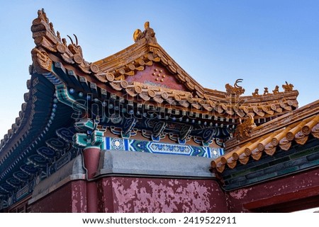 Beautiful Chinese architectural ornament adorning a roof at a historical traditional palace used by the Chinese Royal Families.