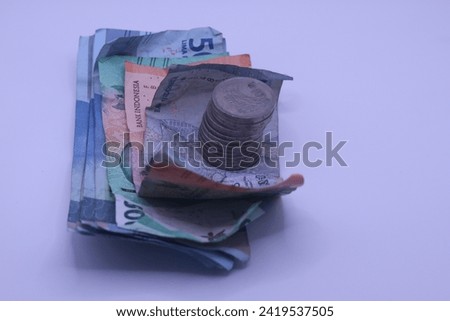 A collection of banknotes and rupiah coins is a tool used for buying and selling transactions