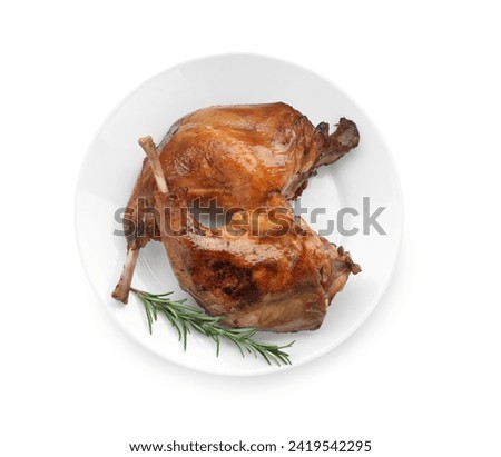 Tasty cooked rabbit meat with rosemary isolated on white, top view